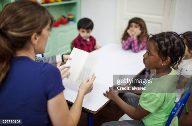 teacher teaching preschool students - narrating stock pictures, royalty-free photos & images