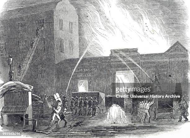 Engraving depicting fire-fighters battle a blaze near Tottenham Court Road, London. The appliances being used here are of the chest type and were...
