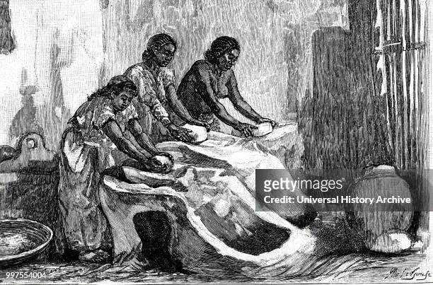 Engraving depicting Assyrian woman grinding corn. Dated 19th century.