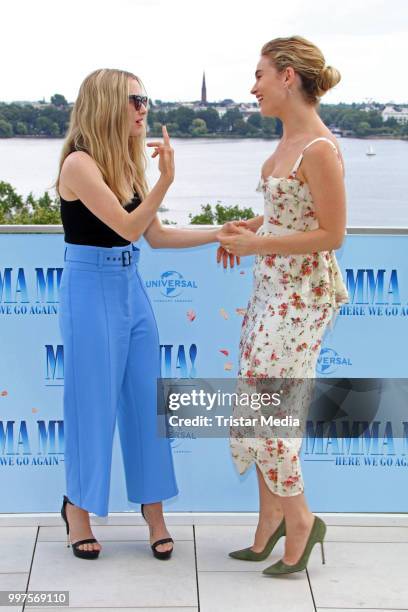 Amanda Seyfried and Lily James during the Mamma Mia! Here we go again' Musical Photo Call on July 12, 2018 in Hamburg, Germany.