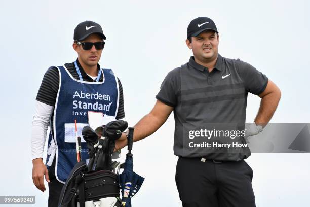 Patrick Reed of USA looks on with his caddy before his tee shot on hole four during day two of the Aberdeen Standard Investments Scottish Open at...