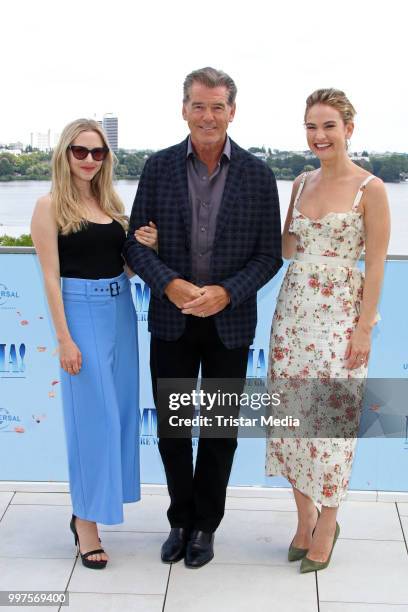 Amanda Seyfried, Pierce Brosnan and Lily James during the Mamma Mia! Here we go again' Musical Photo Call on July 12, 2018 in Hamburg, Germany.