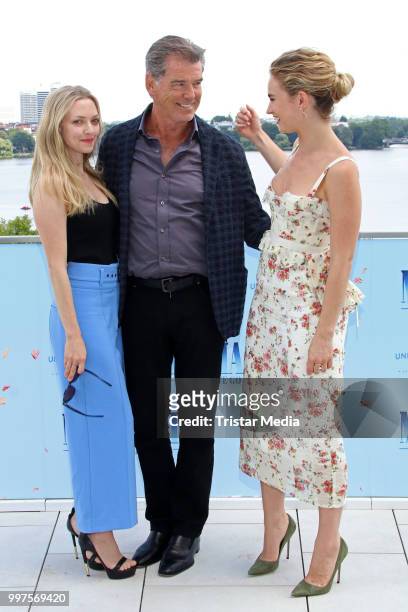 Amanda Seyfried, Pierce Brosnan and Lily James during the Mamma Mia! Here we go again' Musical Photo Call on July 12, 2018 in Hamburg, Germany.