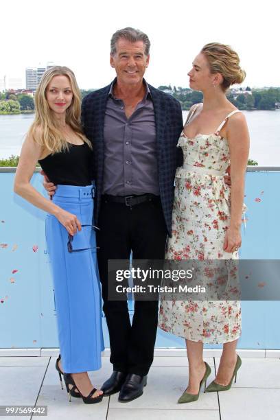 Amanda Seyfried, Pierce Brosnan and Lily James during the Mamma Mia! Here we go again' Musical Photo Call on July 12, 2018 in Hamburg, Germany.