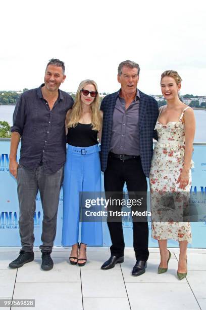 Ol Parker, Amanda Seyfried, Pierce Brosnan and Lily James during the Mamma Mia! Here we go again' Musical Photo Call on July 12, 2018 in Hamburg,...