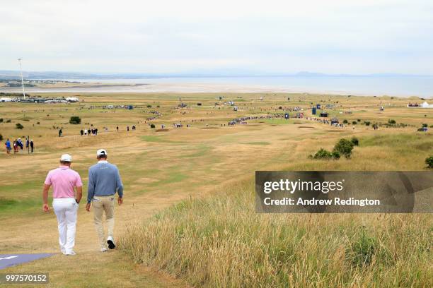 Lee Westwood of England and Matt Kuchar of USA walk down the fairway on hole six during day two of the Aberdeen Standard Investments Scottish Open at...
