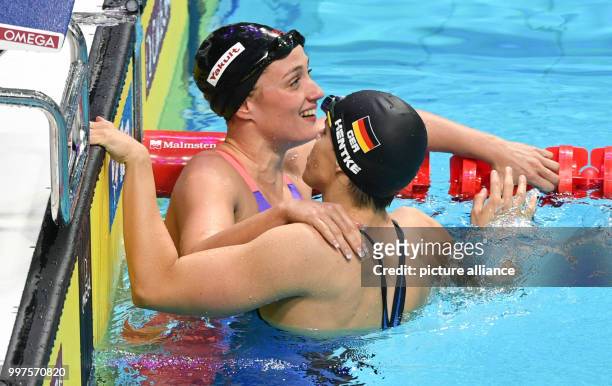 Mireia Belmonte of Spain is congratulated by Franziska Hentke of Germany after the women's 200m butterfly final at the FINA World Championships 2017...