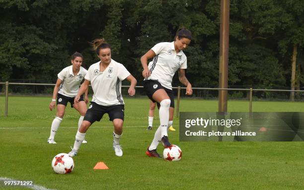 Germany's Dzsenifer Marozsan and Lina Magull during a Germany training session near Sint-Michielsgestel, the Netherlands, 27 July 2017. Photo: Carmen...