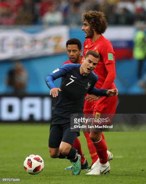 Marouane Fellaini of Belgium vies with Antoine Griezmann of France during the 2018 FIFA World Cup Russia Semi Final match between Belgium and France...