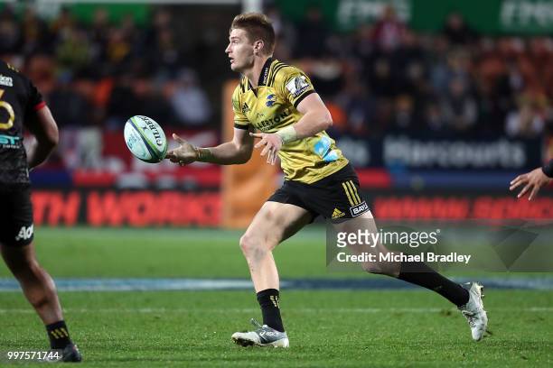 Hurricanes' Jordie Barrett passes the ball during the round 19 Super Rugby match between the Chiefs and the Hurricanes at Waikato Stadium on July 13,...