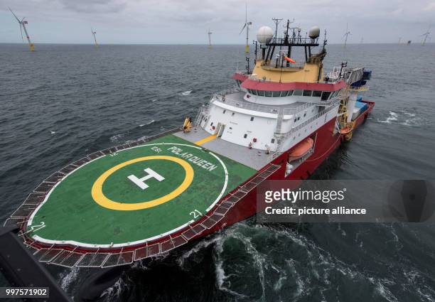 The service ship "Polar Queen" sails through the offshore wind park "Nordsee 1" in front of the East Frisian island Spiekeroog, Germany, 27 July...