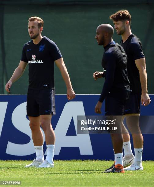 England's forward Harry Kane, England's midfielder Fabian Delph and England's defender Gary Cahill take part in a training session in Repino near...