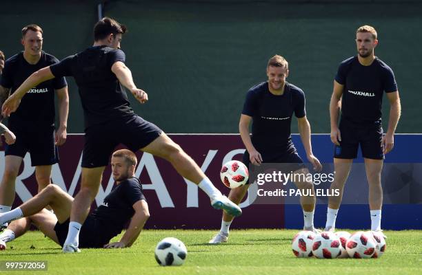 England's defender Phil Jones, England's midfielder Eric Dier, England's defender Harry Maguire, England's forward Jamie Vardy and England's...