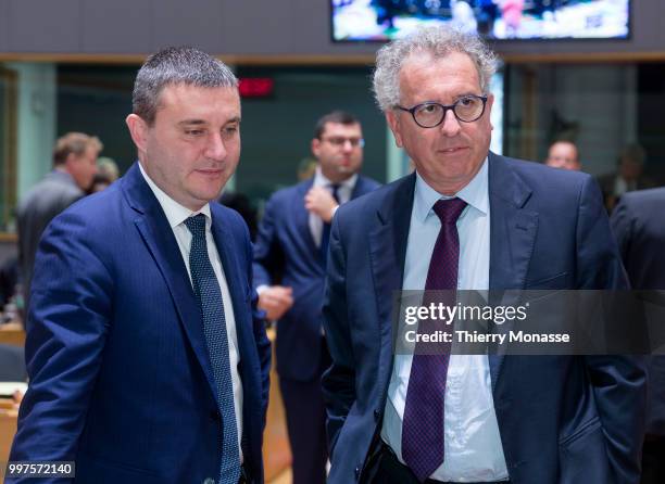 Bulgarian Finance Minister Vladislav Goranov is talking with the Luxembourg Minister of Finance, Treasury, & Budget Pierre Gramegna during an EU...