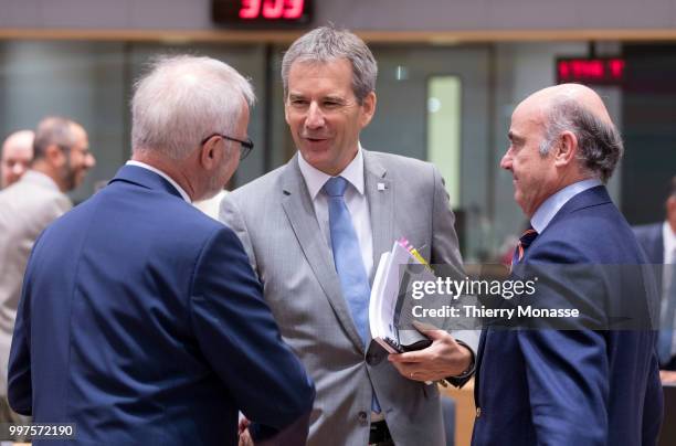 President of the European Investment Bank Werner Hoyer is talking with the Austrian Finance Minister, President of the Council Hartwig Loeger and the...