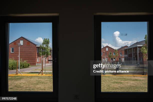 July 2018, Netherlands, Ter Apel: View out of a window of a washing room in unoccupied accomodation at the main reception centre for asylum seekers....