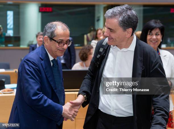 Italian Minister Economy & Finance Giovanni Tria is talking with the Greek Finance Minister Euclid Tsakalotos during an EU EcoFin Ministers meeting...