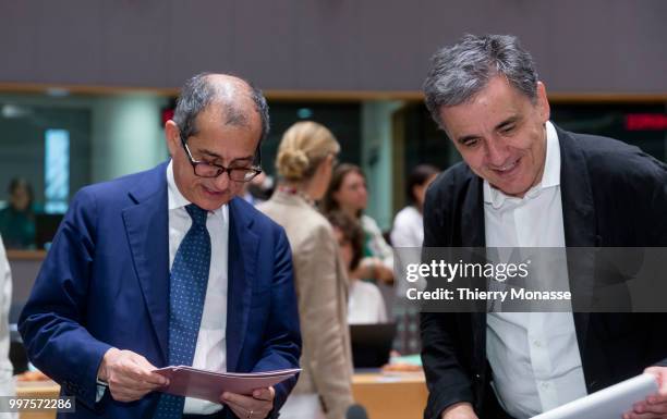 Italian Minister Economy & Finance Giovanni Tria is talking with the Greek Finance Minister Euclid Tsakalotos during an EU EcoFin Ministers meeting...