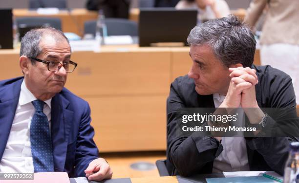 Italian Minister Economy & Finance Giovanni Tria is talking with the Greek Finance Minister Euclid Tsakalotos during an EU EcoFin Ministers meeting...