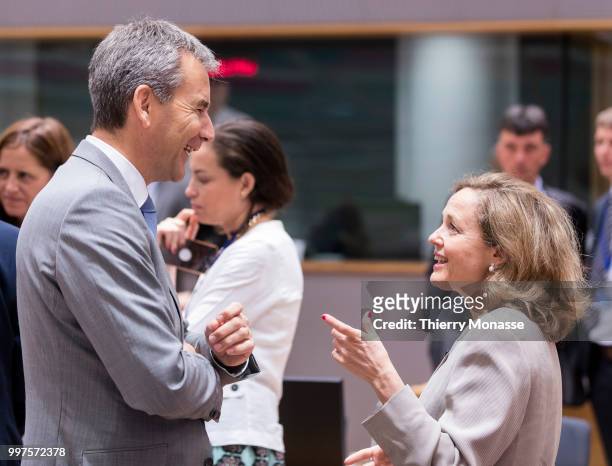 Austrian Finance Minister, President of the Council Hartwig Loeger is talking with the Spanish Minister of Minister of Economy, Industry and...