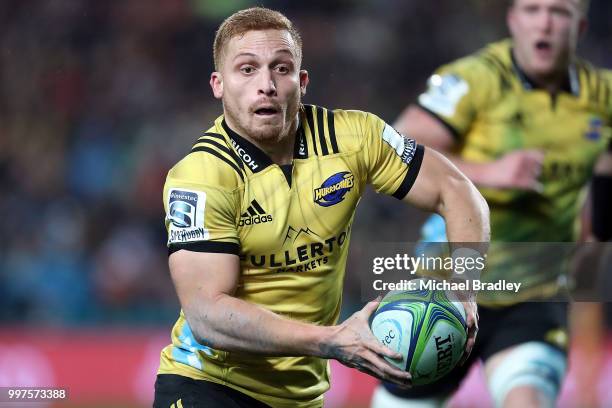 Hurricanes' Ihaia West looks to pass the ball during the round 19 Super Rugby match between the Chiefs and the Hurricanes at Waikato Stadium on July...