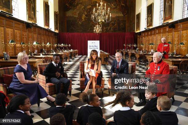 First Lady, Melania Trump, accompanied by Philip May, meets schoolchildren and British Army veterans, known as Chelsea Pensioners, at Royal Hospital...
