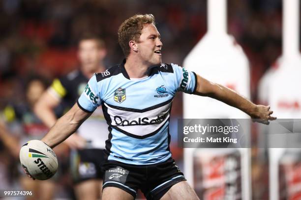 Matt Moylan of the Sharks celebrates scoring a try during the round 18 NRL match between the Panthers and the Sharks at Panthers Stadium on July 13,...