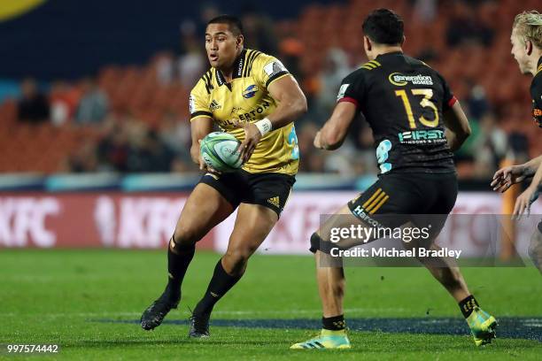 Hurricanes' Julian Savea passes the ball during the round 19 Super Rugby match between the Chiefs and the Hurricanes at Waikato Stadium on July 13,...