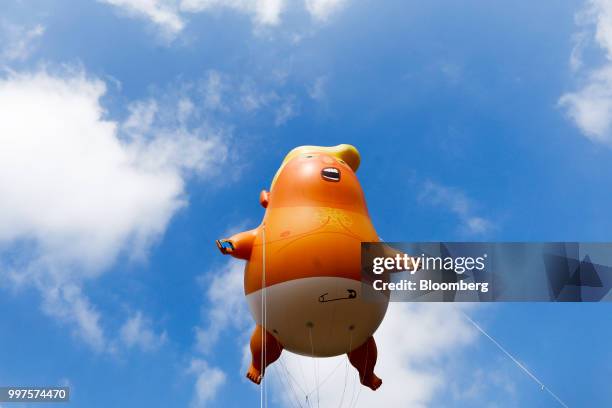 The 'Trump Baby' blimp, a six meter-high helium-filled effigy of U.S. President Donald Trump, flies over Parliament Square in London, U.K., on...