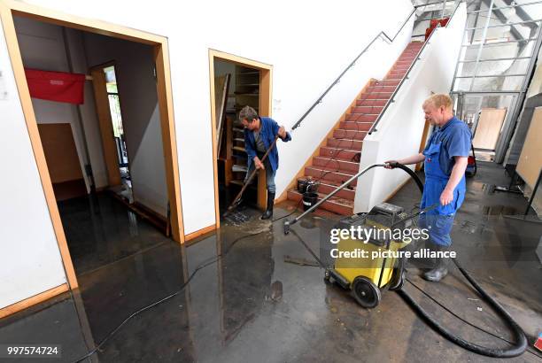 Water and mud are being cleaned up by the university employees Andreas Schwetje and Bernward Vogt in the rooms of the Kulturcampus Domaene Marienburg...