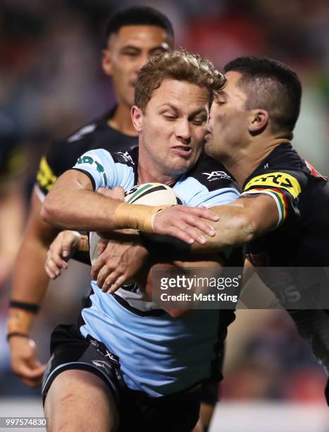 Matt Moylan of the Sharks beats the defence to score a try during the round 18 NRL match between the Panthers and the Sharks at Panthers Stadium on...