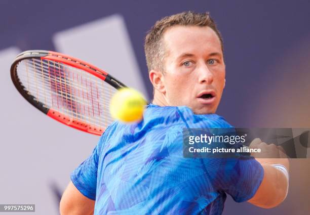 Philipp Kohlschreiber from Germany in action against G. Simon from France in the men's singles at the Tennis ATP-Tour German Open in Hamburg,...