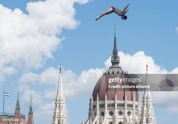 Dpatop - Sergio Guzman from Mexico in action during the preliminary round of the men's cliff jumping competition in Budapest, Hungary, 28 July 2017....