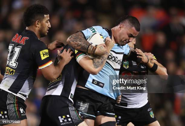 Andrew Fifita of the Sharks is tackled during the round 18 NRL match between the Panthers and the Sharks at Panthers Stadium on July 13, 2018 in...