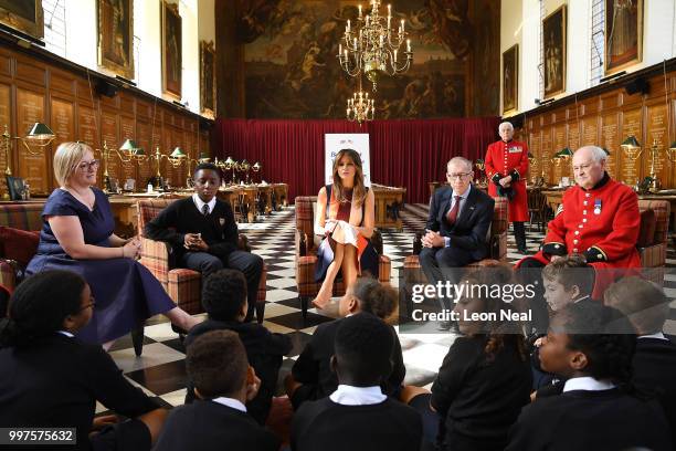 First Lady, Melania Trump, accompanied by Philip May, meets schoolchildren and British Army veterans, known as Chelsea Pensioners, at Royal Hospital...