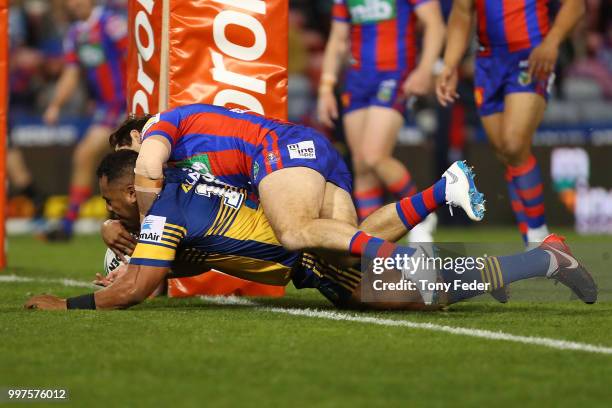 Siosaia Vave of the Eels scores a try during the round 18 NRL match between the Newcastle Knights and the Parramatta Eels at McDonald Jones Stadium...