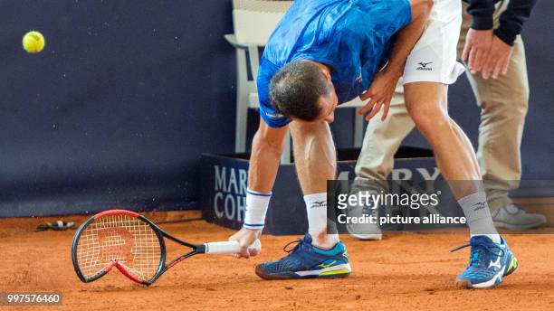 Philipp Kohlschreiber from Germany in action against Kicker from Argentina in the men's singles at the Tennis ATP-Tour German Open in Hamburg,...