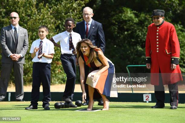 First Lady, Melania Trump, tries her hand at bowls as she meets British Army veterans, known as Chelsea Pensioners, at Royal Hospital Chelsea on July...