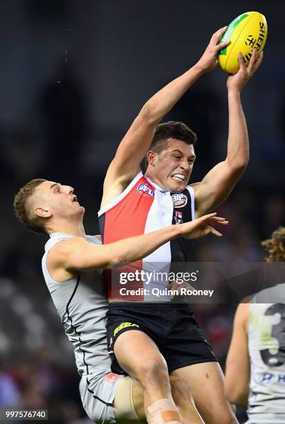 Rowan Marshall of the Saints marks infront of Liam Jones of the Blues during the round 17 AFL match between the St Kilda Saints and the Carlton Blues...