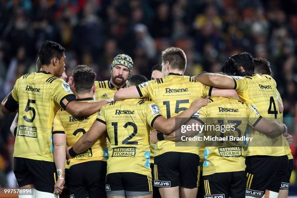 Hurricanes' have a team huddle during the round 19 Super Rugby match between the Chiefs and the Hurricanes at Waikato Stadium on July 13, 2018 in...