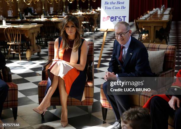 First Lady Melania Trump accompanied by the British prime minister's husband Philip May takes questions from school children as she meets British...