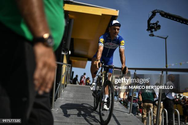 Belgium's Philippe Gilbert rides down the podium's ramp prior to the seventh stage of the 105th edition of the Tour de France cycling race between...