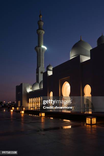 sheikh zayed white mosque in abu dhabi at night - zayed stock pictures, royalty-free photos & images