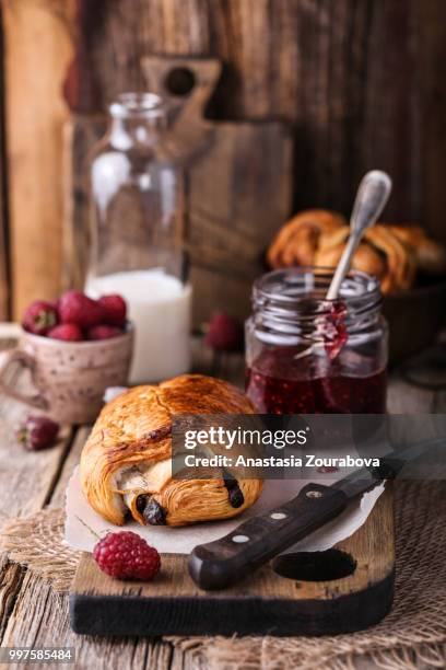 pain au chocolat with raspberry jam. - raspberry jam stock pictures, royalty-free photos & images