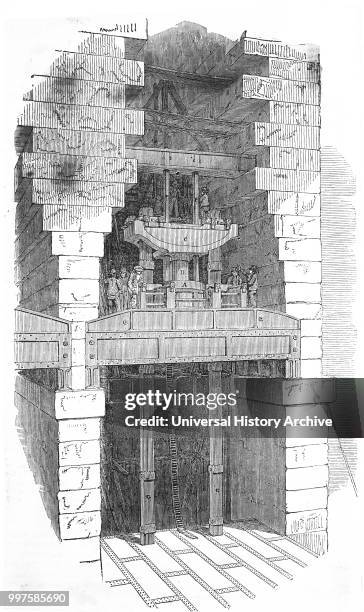 Engraving depicting a hydraulic lifting gear used to raise the tubes of Britannia bridge over the Menai Straits into position. Dated 19th century.