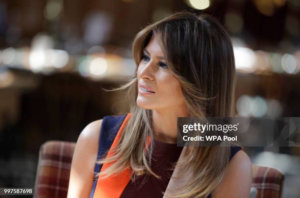 First Lady Melania Trump takes a seat during a visit to Royal Hospital Chelsea on July 13, 2018 in London, England. America's First Lady visited the...