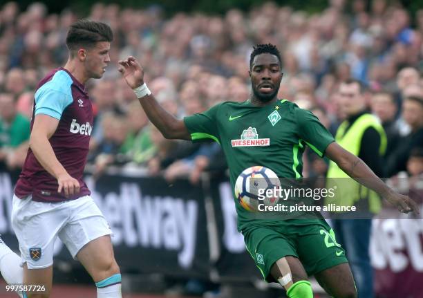 West Ham's Reece Burke and Bremen's Ludovic Lamine Sane in action during the soccer test match between Werder Bremen and West Ham United in...