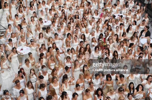 Women in wedding dresses participate in a world record attempt titled 'Nacht der 1001. Braut' in Pforzheim, Germany, 28 July 2017. At least 909 women...