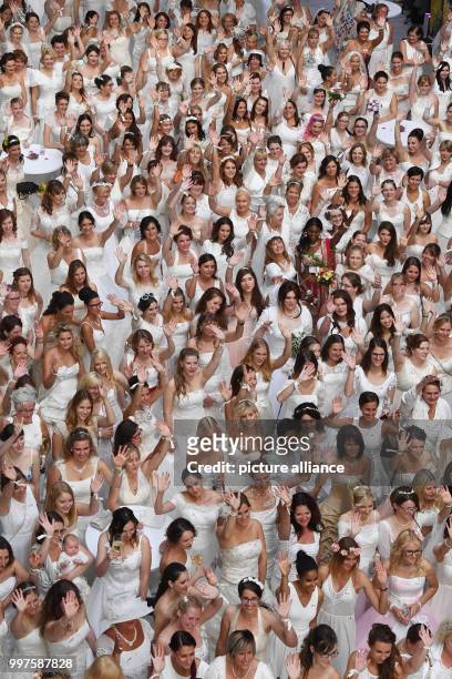 Women in wedding dresses participate in a world record attempt titled 'Nacht der 1001. Braut' in Pforzheim, Germany, 28 July 2017. At least 909 women...