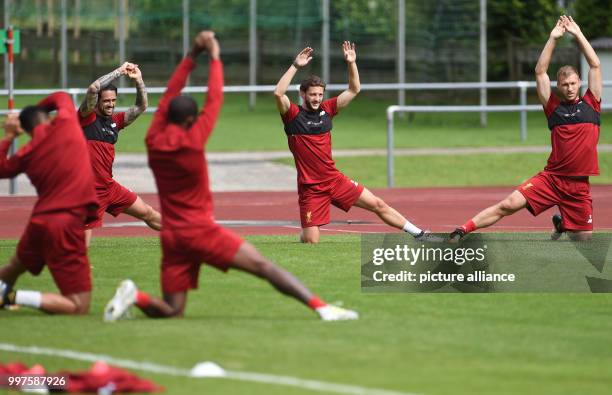 Ragnar Klavan and Adam Lallana stretch during the training camp of British Premier League club FC Liverpool in Rottach-Egern, Germany, 28 July 2017....